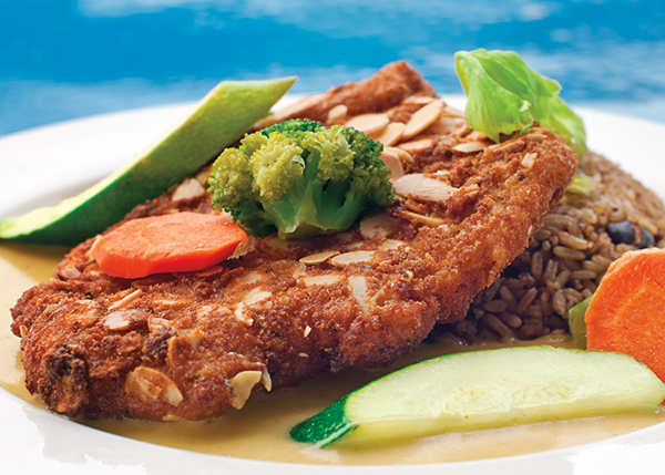 A photograph of The Sharkbite’s Signature Dish is their Almond Encrusted Grouper at Turtle Cove Marina, Turtle Cove, Providenciales (Provo), Turks and Caicos Islands.
