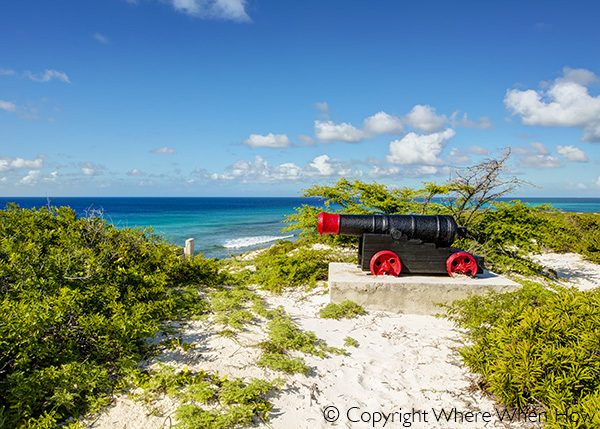 A photograph of a canon overlooking the east coast of Salt Cay, Turks and Caicos Islands, British West Indies