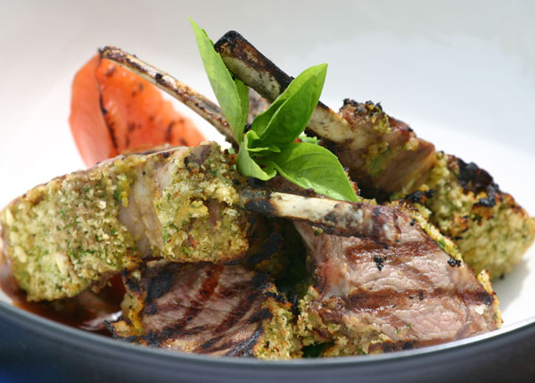 A photograph of a delightful Rack of Lamb at Bay Bistro on Grace Bay Beach, Providenciales (Provo), Turks and Caicos Islands.